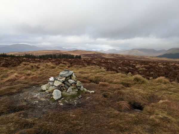 Summit cairn in gloomy weather